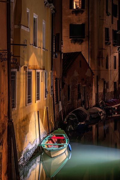 Jaynes Gallery 아티스트의 Europe-Italy-Venice-Wooden boat and reflections on still canal at night작품입니다.